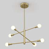 A modern brass chandelier with a central rod and six arms, each ending in a round frosted bulb, arranged in a geometric, star-like pattern against a plain light gray background.