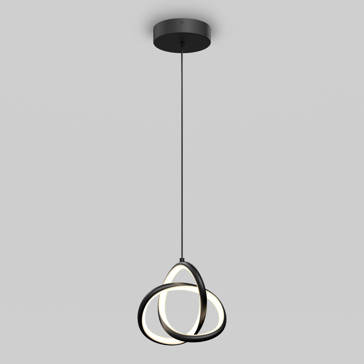 A modern pendant light with three intersecting black rings, each containing an LED strip, hangs from a round black ceiling mount against a plain gray background.
