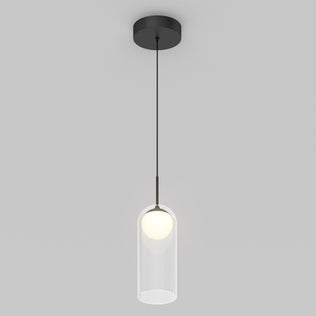 The Artika Mirah LED modern mid-century pendant light 3 CCT features a black ceiling mount and cord with a clear cylindrical glass shade around a glowing bulb, set against a plain light gray background.