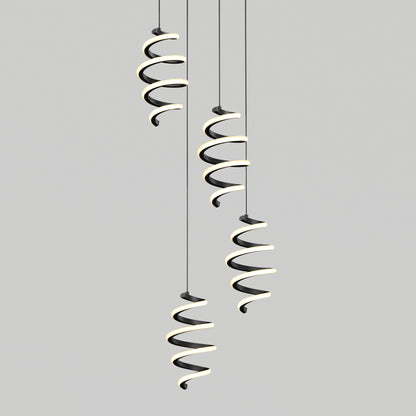 Four modern Chorus LED pendant lights by Artika, featuring spiral black and white designs, hang at varying heights against a plain gray background.