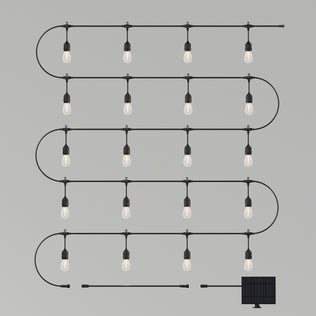The Artika Blaze 20 LED Outdoor Solar String Lights feature 20 evenly spaced bulbs in a zigzag pattern, with a weather-resistant LED string and a compact solar panel attached. Shown against a plain gray background.