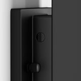Close-up view of a black, modern door hinge with a cylindrical screw and textured adjustment knob, mounted on a door and frame with a smooth, matte finish.