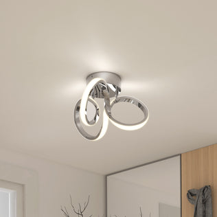 Artika Swirl LED flush mount features two illuminated loops, ideal for modern spaces and fits perfectly on a white ceiling.