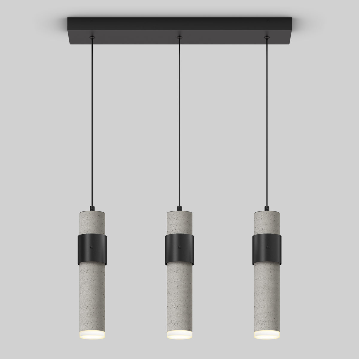 The Artika Barden 3-light LED pendant features cylindrical gray concrete bodies with black bands, suspended in a row from a rectangular black ceiling mount by thin black cords, set against a plain light gray background.