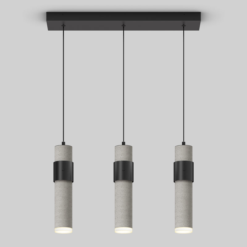 The Artika Barden 3-light LED pendant features cylindrical gray concrete bodies with black bands, suspended in a row from a rectangular black ceiling mount by thin black cords, set against a plain light gray background.