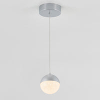 The Artika Sparkle 1 light LED pendant features a round, textured white globe suspended by a slim cord from a circular silver ceiling mount, shown against a plain white background.