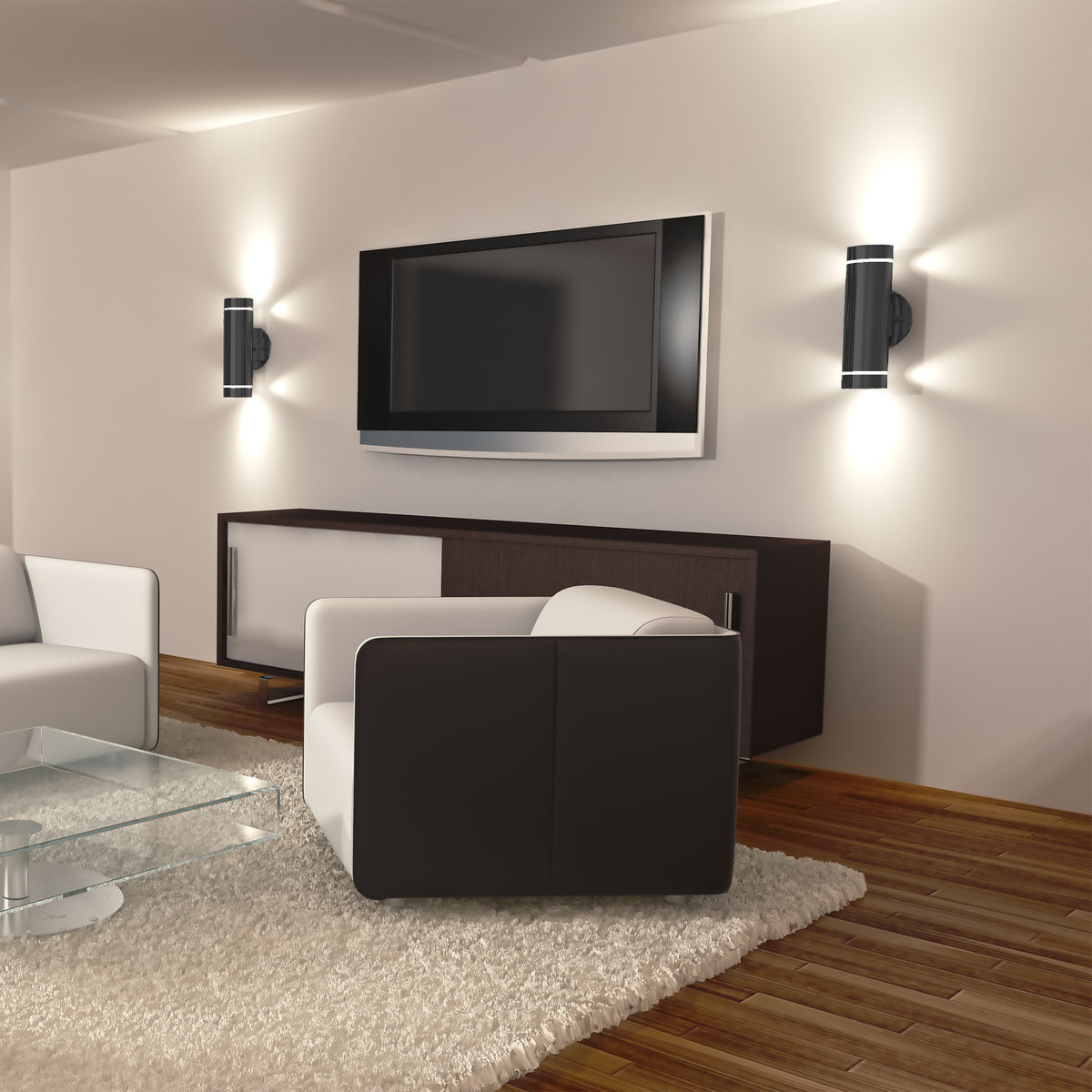 Modern living room with a wall-mounted TV, two black-and-white armchairs, a glass coffee table on a white rug, wooden floor, and two Artika C7 indoor-outdoor wall lights creating soft illumination.