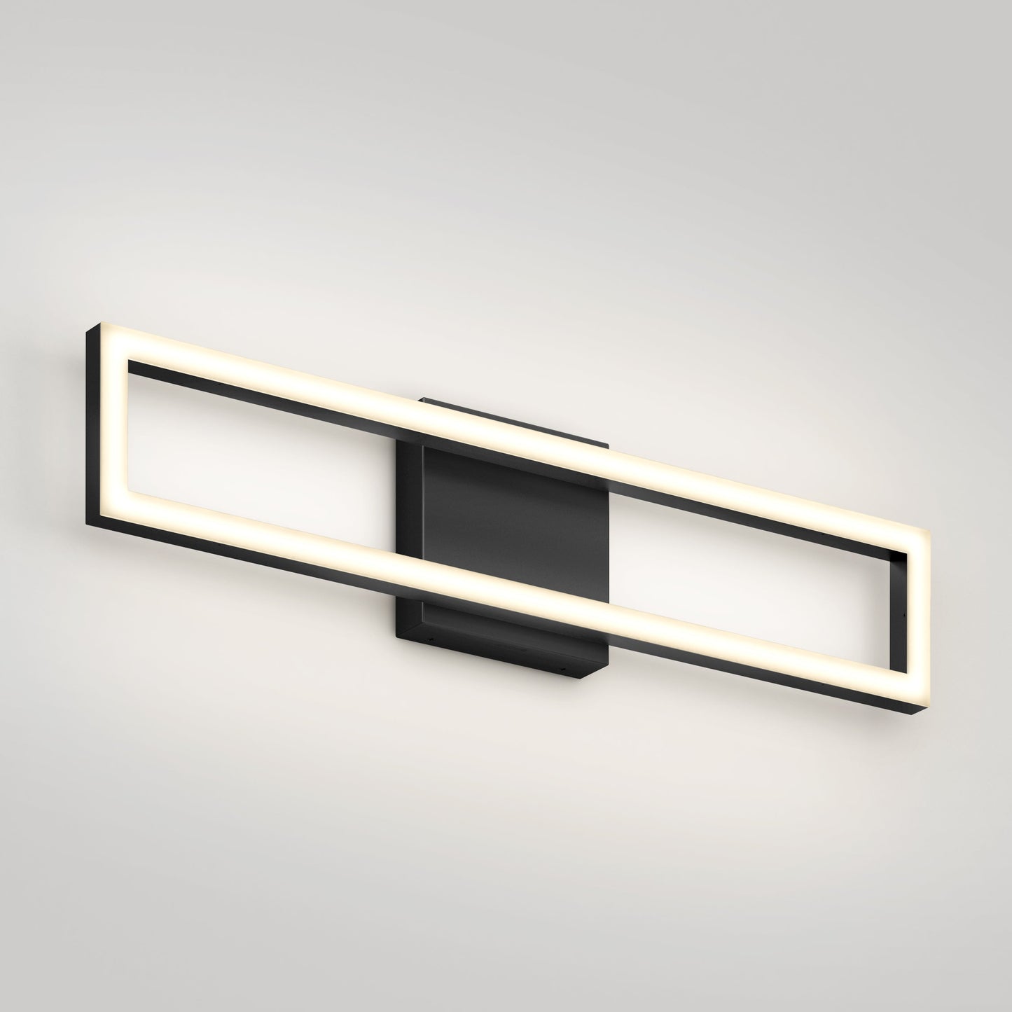 The Artika-CAN-dev Dover modern LED bathroom vanity light 5 CCT features a black central base and open rectangular frame with glowing LED, mounted on a plain light-colored wall.