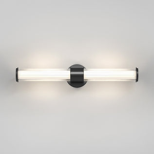 The Artika Kendra LED contemporary bathroom vanity light 3 CCT has a modern tubular design with a matte black finish, cylindrical frosted glass shade, and black base, emitting soft white light for a sleek look.