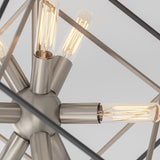 Close-up of a modern metal chandelier with exposed Edison-style light bulbs arranged in a radial pattern, set against a white ceiling background.