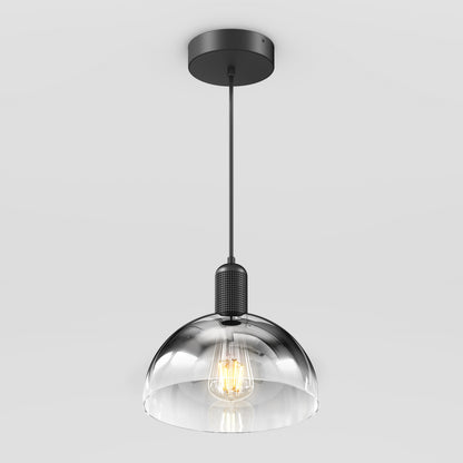 The Artika Nella Pendant without Bulbs features a clear glass dome shade, black metal fixture, and hangs from a black cord against a plain white background.