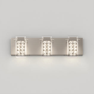 The Artika Crystal Cube LED bathroom vanity light 5 CCT is a modern wall-mounted fixture with three rectangular lights on a brushed metal plate, each encased in clear panels and featuring crystal-style accents for a soft, bright glow.