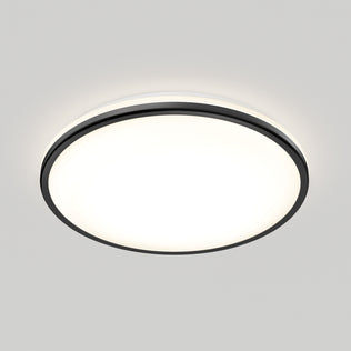 The Artika Macy 15 in. LED RGB WiFi flush mount casts bright, even white light on a plain gray ceiling with a sleek black rim.