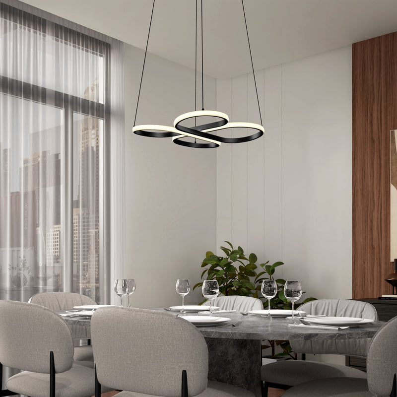 A modern dining room features a marble table for six, gray upholstered chairs, large windows with sheer curtains, a green potted plant in the corner, and an Artika Atrium LED pendant light 5CCT as a sculptural black and white centerpiece.