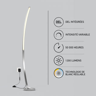 The Artika Arc LED Floor Lamp stands by a wall outlet. French icons highlight its features: dimmable, 50,000-hour lifespan, 1200 lumens, and adjustable white LED technology.
