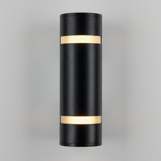 The Artika D4 indoor-outdoor wall light is a modern black cylindrical sconce with illuminated bands at the top and bottom, shown mounted on a light gray wall.