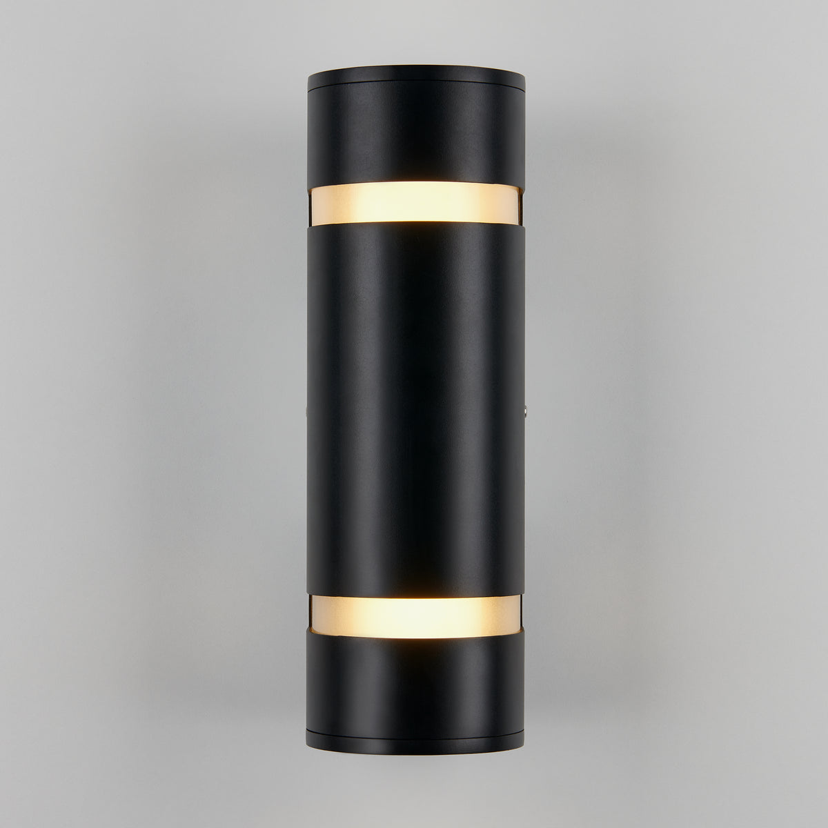 A modern cylindrical black wall sconce with two illuminated bands near the top and bottom, mounted on a light gray wall.