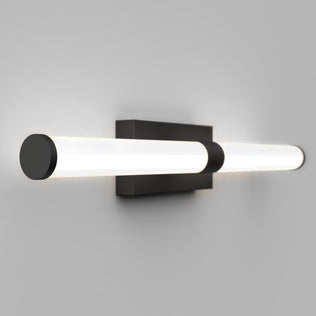 The Artika Vitoro modern LED bathroom vanity light features two parallel cylindrical LED tubes on a rectangular black base, casting soft white light—ideal for adding stylish, contemporary flair to your home.