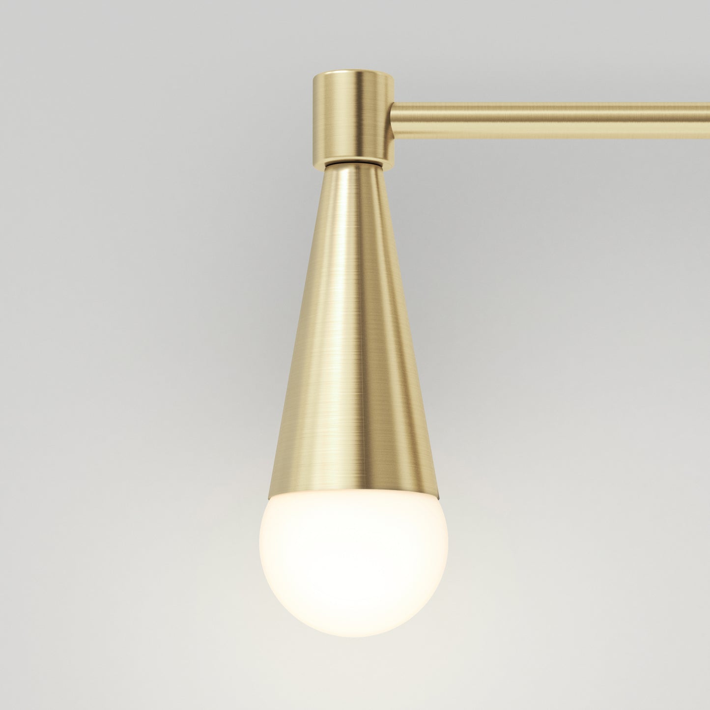 The Wayden LED mid-century bathroom vanity light by Artika features a brushed gold cone-shaped metal fixture with a frosted round bulb, shown mounted against a plain light gray background.