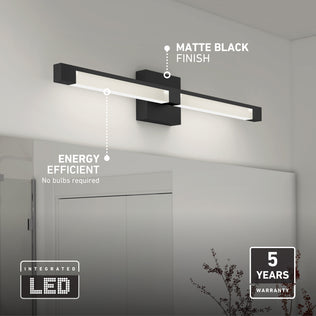 Artika Tivoli 27-in (69 cm) Integrated LED 5-CCT Vanity Light Bar in matte black above a mirror, with labels for finish, efficiency, and warranty.