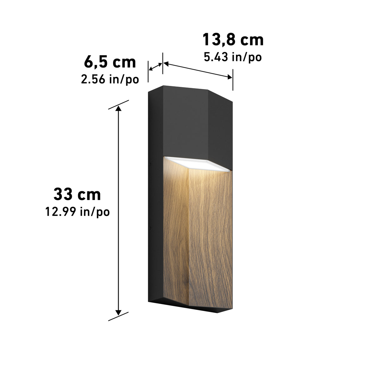 A modern wall light fixture with black and wood finishes, emitting warm light downward. The dimensions are labeled: 33 cm (12.99 in) tall, 13.8 cm (5.43 in) wide, and 6.5 cm (2.56 in) deep.