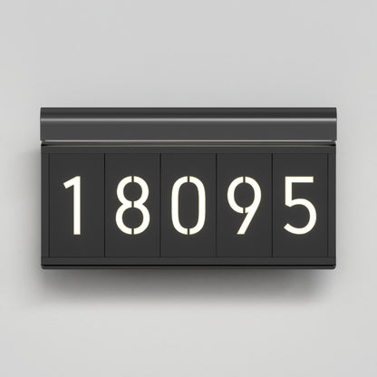 The Artika Bowen modern LED outdoor address wall light 5 CCT features illuminated white numbers on a sleek black design, enhancing your exterior with style and visibility.