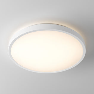 The Artika Isara 12 in. RGBIC LED Flush Mount shines on a plain ceiling with its round, white interchangeable trim.