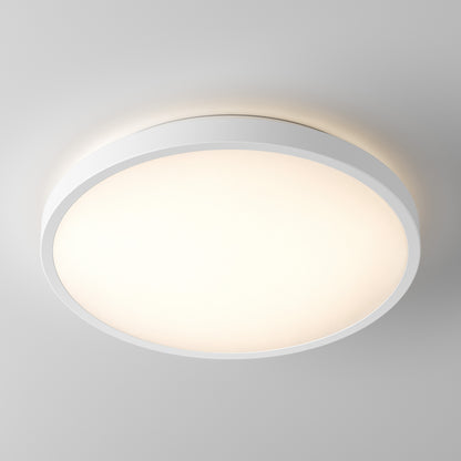 The Artika Isara 12 in. RGBIC LED Flush Mount shines on a plain ceiling with its round, white interchangeable trim.