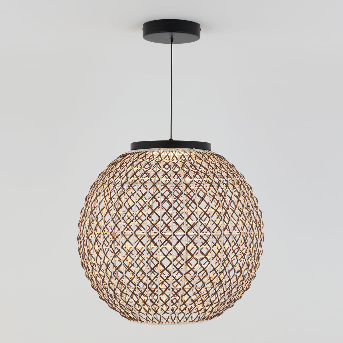 A spherical pendant light with a woven, lattice-style rattan shade hangs from a black ceiling mount against a plain white background.
