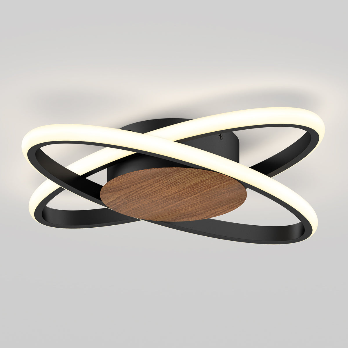 A modern ceiling light fixture with two intersecting black rings containing LED lights, attached to a circular wooden base, mounted on a light gray ceiling.