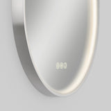 A close-up of a round, modern wall mirror with built-in LED lighting around the edge and an illuminated digital clock display reading 8:00 at the bottom of the mirror.