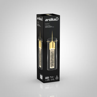 A tall black Artika box showcases the Essence LED pendant light, featuring a gold fixture and a bubble-filled cylindrical glass shade, set against a light gray gradient background.