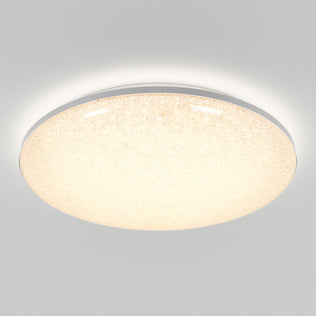 The Artika Sparkle LED flush mount light, featuring a smooth, slightly textured surface, installs flush to the ceiling and emits a soft, warm glow across any plain white ceiling. Includes remote control for effortless brightness adjustment.