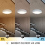 A ceiling light above a closet is shown in three color temperatures: 3000K (warm white), 4000K (neutral white), and 5000K (cool white). Text below reads Selectable White in English, French, and Spanish.
