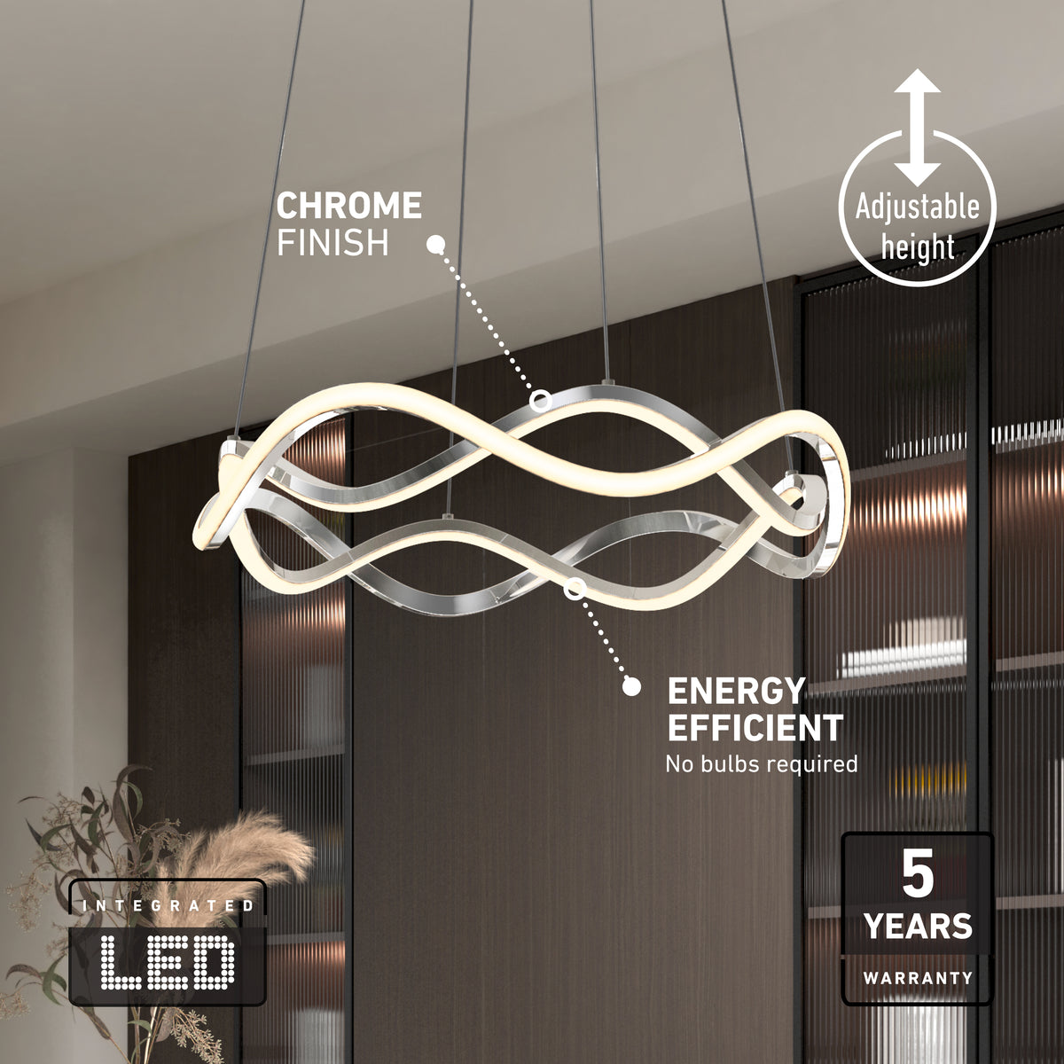 Modern LED chandelier with wavy, chrome-finished light fixture, suspended from the ceiling by cables. Features include adjustable height, energy efficiency (no bulbs required), and a 5-year warranty. Shelves and decor in the background.