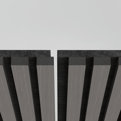 Close-up of two parallel rows of Artika Sonolok 15.5 ft sound-absorbing wall panel kits (4-pack) in dark gray, with a gap between them against a light, neutral background.