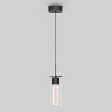 A modern pendant light with a black circular ceiling mount, thin black cord, and a cylindrical glass shade surrounding a textured, illuminated inner tube, against a plain light gray background.