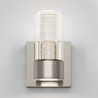 Artika’s Essence 1-light LED bathroom vanity light features a bubbled glass shade and brushed metal base, ideal for dimmable accent lighting.