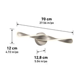 Modern wall light fixture with a twisted design, shown in silver, with dimensions: 70 cm (27.56 in) wide, 12 cm (4.72 in) high, and 12.8 cm (5.04 in) deep. Measurements labeled with arrows.