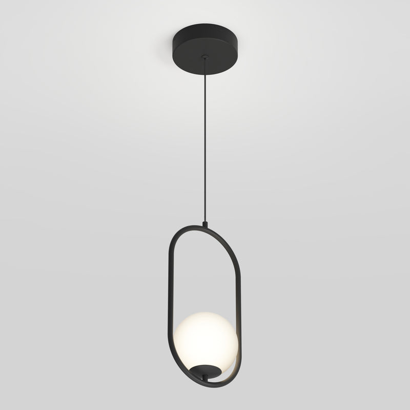 The Artika Bloom mid-century LED pendant light features a round white bulb suspended within an oval black metal frame, hanging from a black ceiling mount against a plain white background.