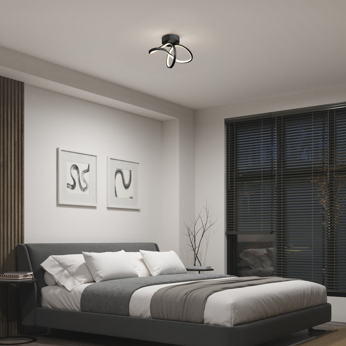 A modern bedroom with a dark upholstered bed, white and gray bedding, two abstract art pieces on the wall, large windows with black blinds, and a sculptural black ceiling light fixture.