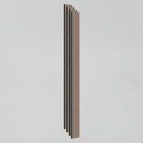 Vertical wooden slats with alternating light and dark stripes are arranged in a staggered formation against a plain white background.