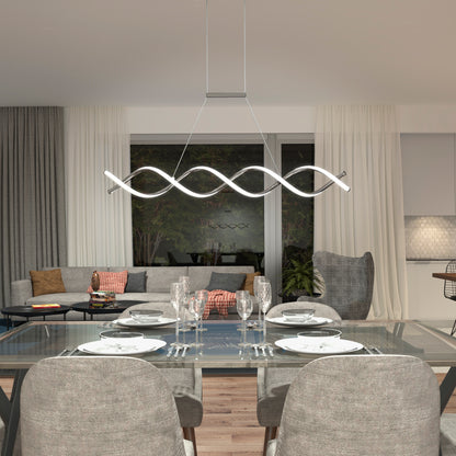 Modern dining and living area with a glass table for four, gray upholstered chairs, an Artika DNA Linear LED modern pendant light, and a gray sectional sofa with decorative pillows in a cozy, well-lit space.
