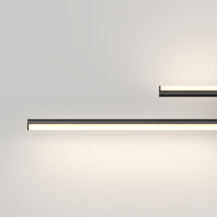 Two Artika Cisco 27-in Integrated LED 5-CCT Vanity Light Bars are mounted on a light wall, one below and a smaller one above right—perfect for bathrooms. Both offer adjustable color temperature for customized lighting ambiance.