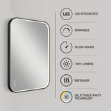 Rectangular LED mirror with illuminated edges, mounted on a gray wall. Features listed beside it include: LED integrated, dimmable, 50,000 hours, 1300 lumens, defogger, and selectable white technology.