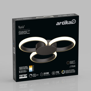 A black box packaging of the Artika Nyala 15 in. LED flush mount light 5CCT, showing the modern fixture with three glowing rings and product details in English, French, and Spanish.