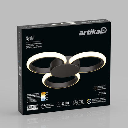 A black box packaging of the Artika Nyala 15 in. LED flush mount light 5CCT, showing the modern fixture with three glowing rings and product details in English, French, and Spanish.