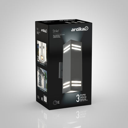 A black box displays the Artika Strike indoor-outdoor wall light, featuring an image of its three-light strip design and in-use photos. The packaging emphasizes its modern look and energy-saving features.