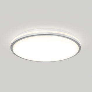 The Artika Macy 15 in. LED modern flush mount light with RGB Wifi is on, featuring a white diffuser and silver trim.