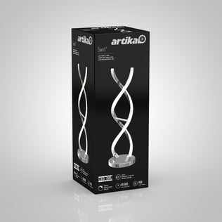 A black rectangular box showcases the Artika Swirl LED table lamp with a modern spiral design, and displays product details and specifications on the packaging.